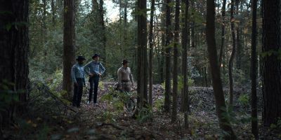 Still from TV Show: Netflix — "Stranger Things: Season 1 - Episode 1" that has been tagged with: 1c352d & forest & bicycle & trees