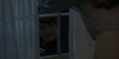 Still from TV Show: Netflix — "Stranger Things: Season 1 - Episode 1" that has been tagged with: over-the-shoulder & interior & night & peeking