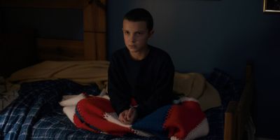 Still from TV Show: Netflix — "Stranger Things: Season 1 - Episode 2" that has been tagged with: medium shot & bedroom & clean single & sitting