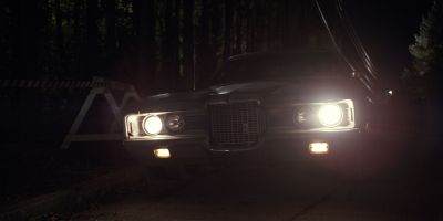 Still from TV Show: Netflix — "Stranger Things: Season 1 - Episode 2" that has been tagged with: night & headlight & car