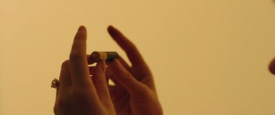 Still from Swallow (2019) that has been tagged with: hands & battery