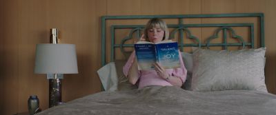 Still from Swallow (2019) that has been tagged with: book & eating & interior & bed & pillow