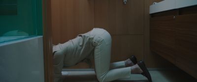 Still from Swallow (2019) that has been tagged with: bathroom & bending over & searching & interior