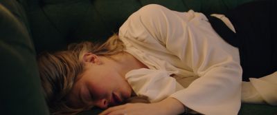Still from Swallow (2019) that has been tagged with: c19b6c & interior & sleeping & couch