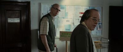 Still from Synecdoche, New York (2012) that has been tagged with: medium wide & mailroom & day