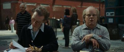 Still from Synecdoche, New York (2012) that has been tagged with: exterior & medium wide & reading