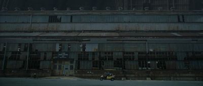 Still from Synecdoche, New York (2012) that has been tagged with: golf cart & warehouse & exterior