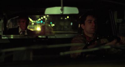Still from Taxi Driver (1976) that has been tagged with: 000000 & two-shot & medium wide & car interior