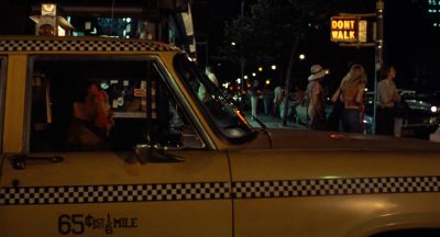 Still from Taxi Driver (1976) that has been tagged with: ff6600 & taxi & exterior