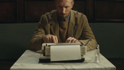 Still from Commercial: SquareSpace — "Storyteller" that has been tagged with: night & cafe & medium shot