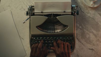 Still from Commercial: SquareSpace — "Storyteller" that has been tagged with: typewriter & hands & cafe