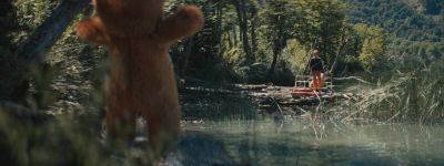 Still from Commercial: McDonald's — "The Bed" that has been tagged with: over-the-shoulder & teddy bear & forest & day & river