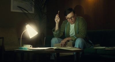 Still from The Fabelmans (2022) that has been tagged with: practical lamp & couch & night & reading & interior