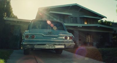 Still from The Fabelmans (2022) that has been tagged with: exterior & driveway & car & lens flare