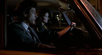 Still from The Fly (1986) that has been tagged with: f4a662 & driving & night & car interior