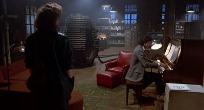 Still from The Fly (1986) that has been tagged with: interior & wide shot & piano