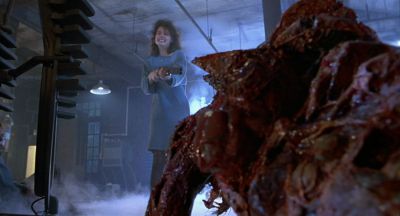 Still from The Fly (1986) that has been tagged with: 5d8aa8 & over-the-shoulder