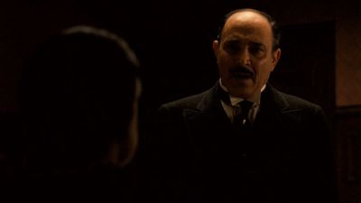 Still from The Godfather (1972) that has been tagged with: medium shot & office & night