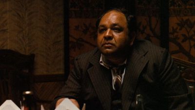Still from The Godfather (1972) that has been tagged with: e6be89 & medium shot & day & clean single & interior