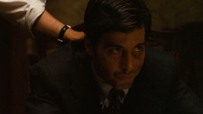 Still from The Godfather (1972) that has been tagged with: interior & low-angle & close-up & day