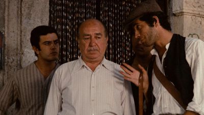 Still from The Godfather (1972) that has been tagged with: 7e461b & day & medium wide & three-shot