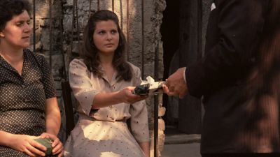 Still from The Godfather (1972) that has been tagged with: medium wide & exterior & giving & over-the-shoulder & day