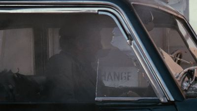 Still from The Godfather (1972) that has been tagged with: car interior & medium shot & glass & gunsmoke & car