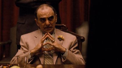 Still from The Godfather (1972) that has been tagged with: table & interior & day & clean single & medium shot