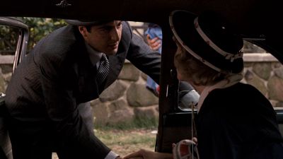 Still from The Godfather (1972) that has been tagged with: car interior & day