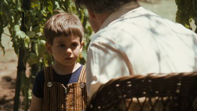 Still from The Godfather (1972) that has been tagged with: exterior & day & over-the-shoulder & child
