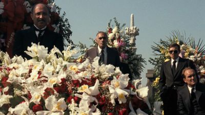 Still from The Godfather (1972) that has been tagged with: funeral & cemetary & flowers & day