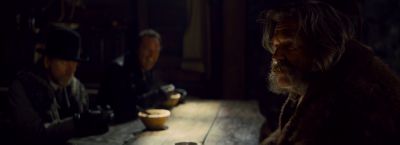 Still from The Hateful Eight (2015) that has been tagged with: interior & medium wide & table & night