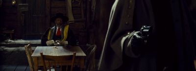 Still from The Hateful Eight (2015) that has been tagged with: 000000 & night & interior & over-the-shoulder & wide shot