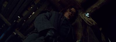 Still from The Hateful Eight (2015) that has been tagged with: low-angle & night & medium shot