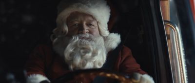 Still from Commercial: Coca Cola — "The Letter" that has been tagged with: medium close-up & santa