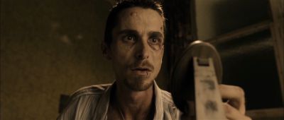 Still from The Machinist (2004) that has been tagged with: interior & clean single & low-angle & medium close-up & day