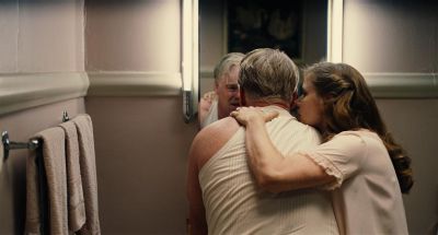 Still from The Master (2012) that has been tagged with: handjob & mirror & two-shot & medium wide