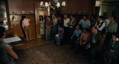 Still from The Master (2012) that has been tagged with: wide shot & group & living room