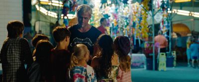 Still from The Place Beyond The Pines (2012) that has been tagged with: 008080 & group-shot & wide shot & amusement park