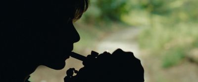 Still from The Place Beyond The Pines (2012) that has been tagged with: 9ab974 & day & smoking & silhouette & close-up