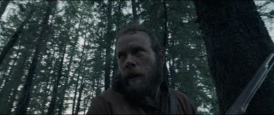 Still from The Revenant (2015) that has been tagged with: exterior & medium close-up & forest