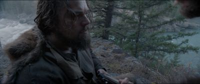 Still from The Revenant (2015) that has been tagged with: exterior & medium close-up & high-angle & day