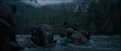Still from The Revenant (2015) that has been tagged with: river & wide shot & forest & gun