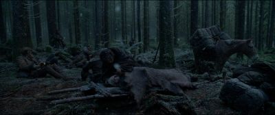 Still from The Revenant (2015) that has been tagged with: forest & woods & day & group-shot & snow