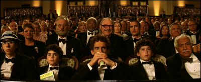 Still from The Royal Tenenbaums (2001) that has been tagged with: audience & group-shot & wide shot & night