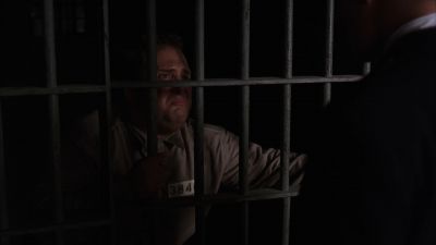 Still from The Shawshank Redemption (1994) that has been tagged with: 3d2b1f & over-the-shoulder & medium shot & night