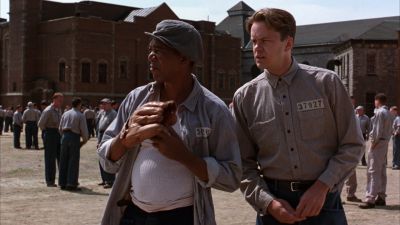 Still from The Shawshank Redemption (1994) that has been tagged with: 714f38 & day & prison yard & medium wide