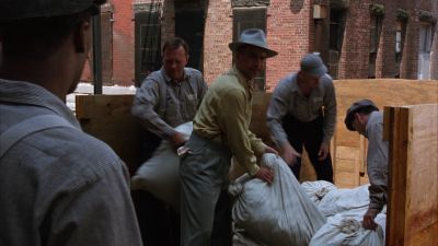 Still from The Shawshank Redemption (1994) that has been tagged with: over-the-shoulder & exterior & medium wide & group-shot