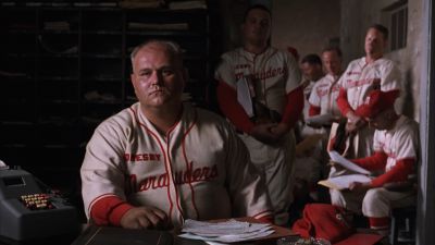 Still from The Shawshank Redemption (1994) that has been tagged with: desk & medium wide & day & locker room