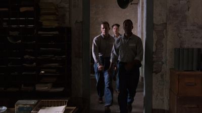 Still from The Shawshank Redemption (1994) that has been tagged with: interior & wide shot & doorway